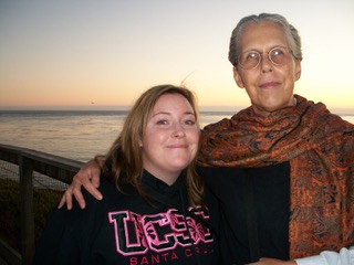 Mary Strong with her niece, with a body of water at sunset behind them.