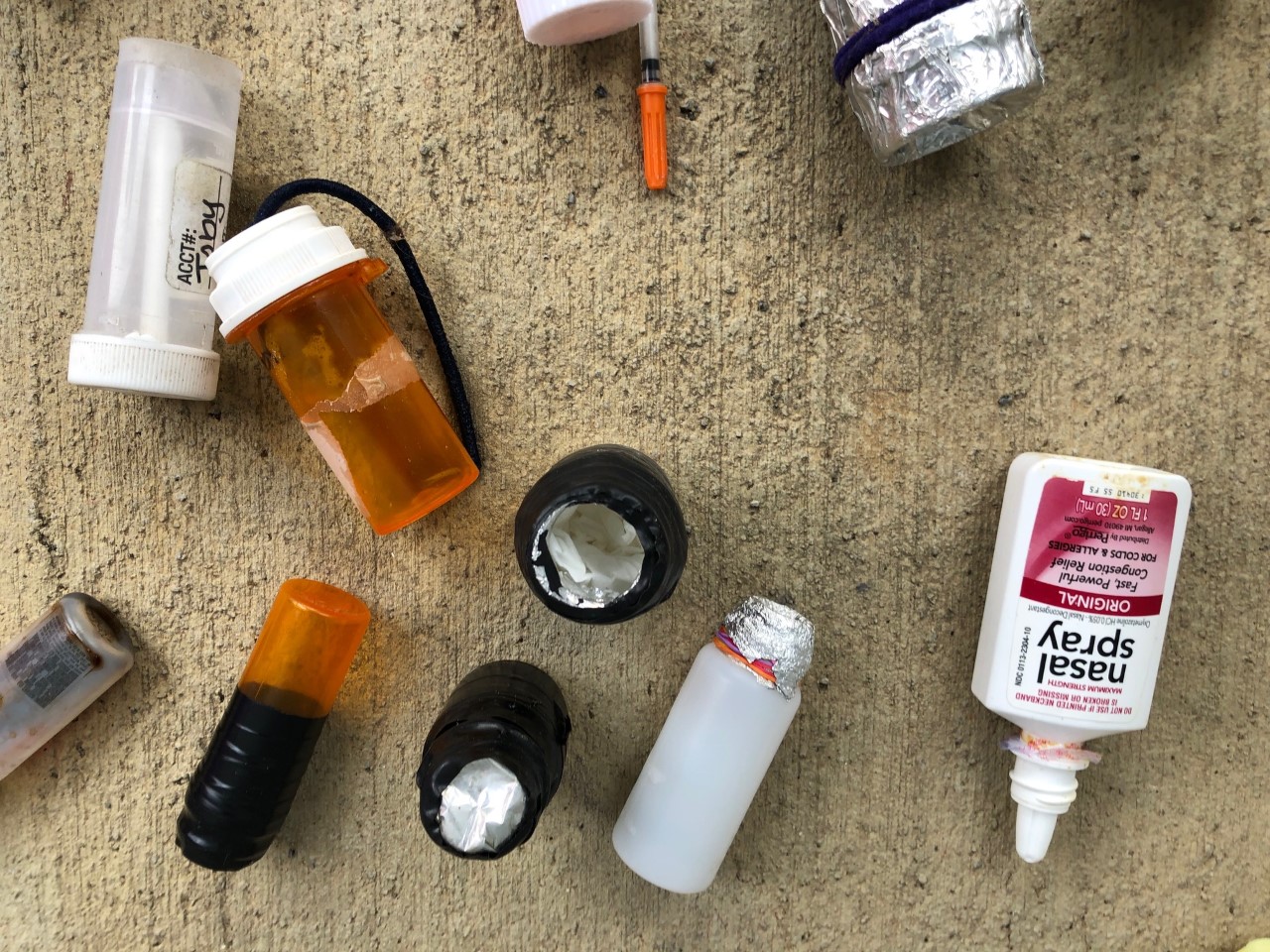 Photograph depicting various devices used for cheating on urine drug screenings.