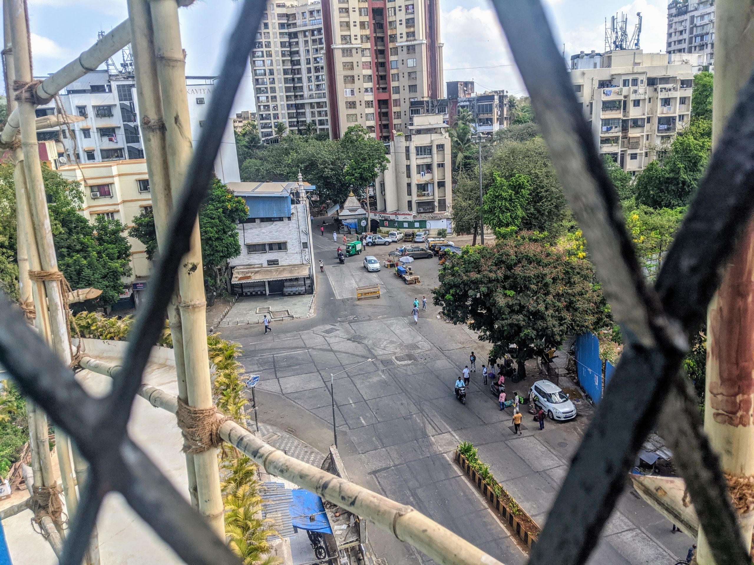 Photograph of a mostly empty street, the same street featured in the previous image.